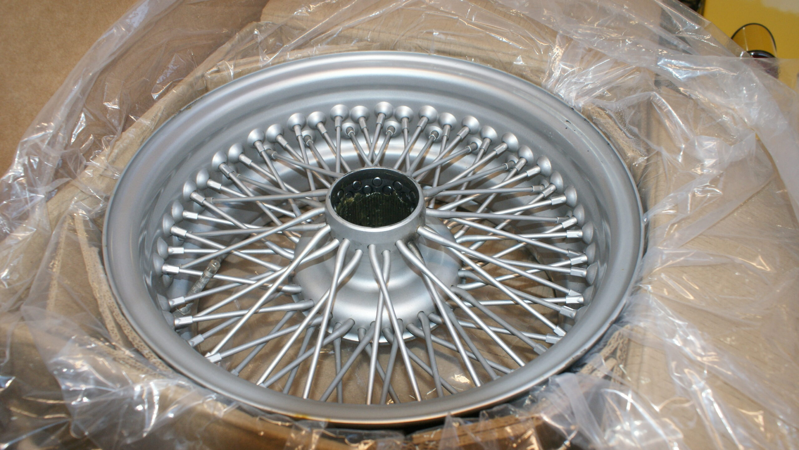 Y180002 USED 15 x 6.5 Silver painted wire wheel CX Plus Four only